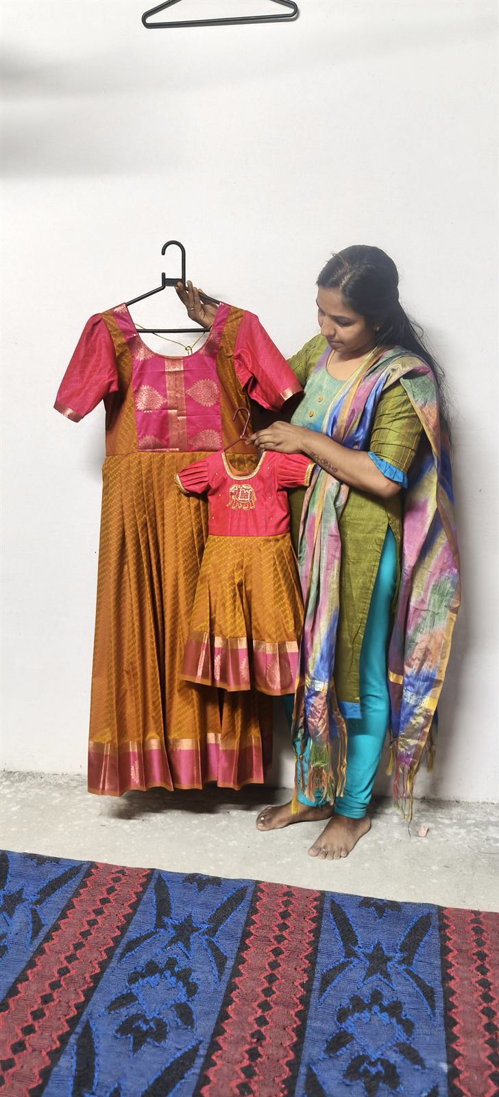 Sanmi Creation designer presenting a hand-finished pattu pavadai
