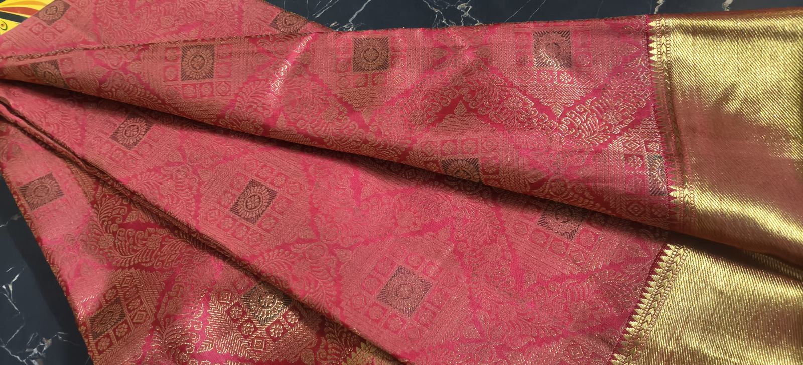 A silk saree with zari border — the starting point for a new outfit