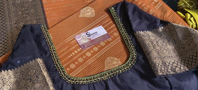 Navy & Orange — Detail — Close-up of the neckline